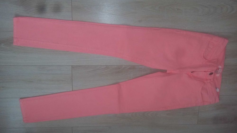 Spodnie roz. 34 neonowy koral
