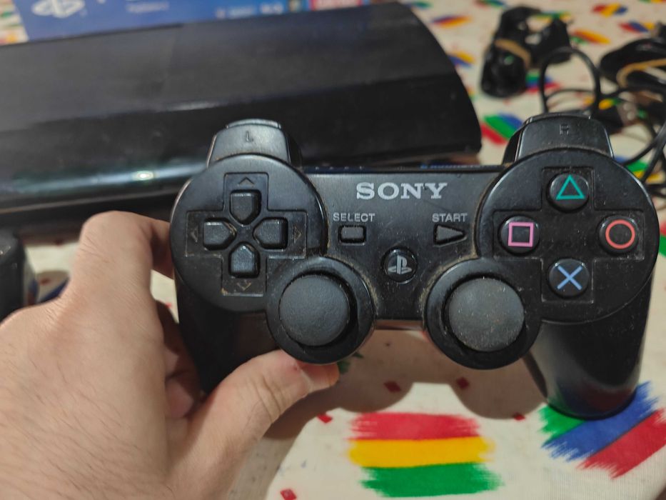 PS3 Super Slim com caixa em ótimo estado