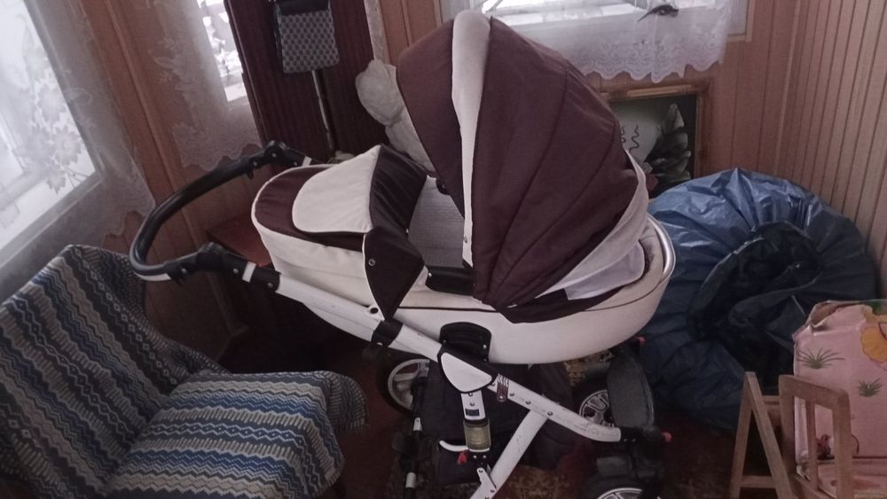 Дитяча коляска для дівчинки чи хлопчика