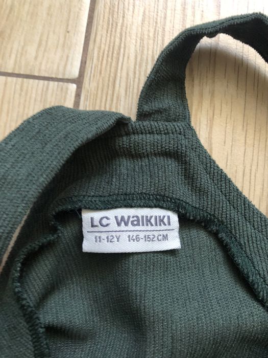 Zielona sukienka na szelkach LC Waikiki 146-152