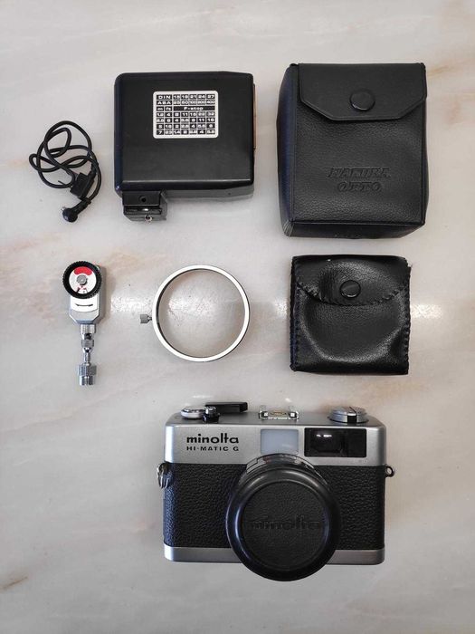 Máquina fotográfica Minolta Hi-Matic G c/ Extras
