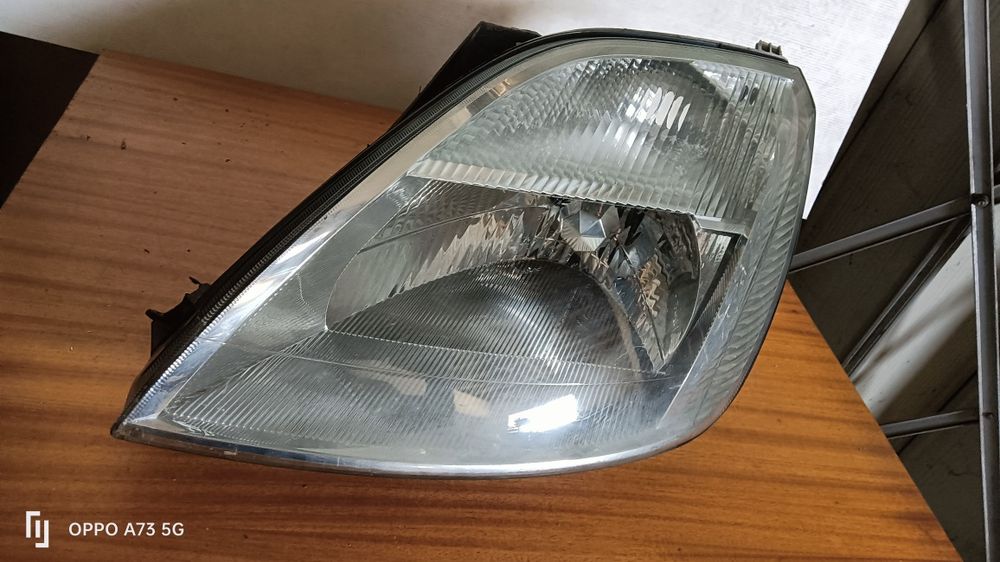 Farol Ford fiesta 5 ótica 2004 esquerda original