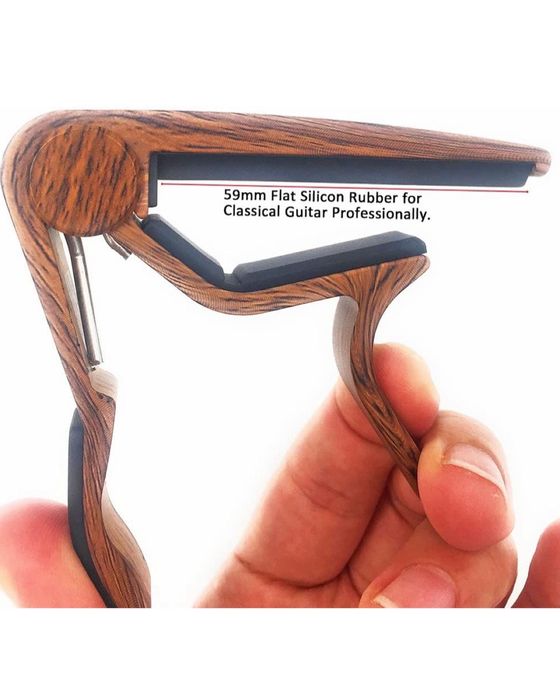 Capo guitarra com oferta de 5 palhetas