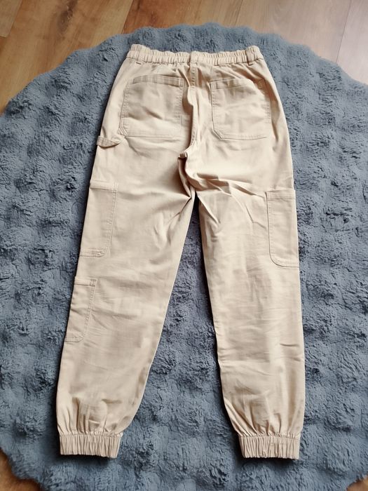 Spodnie z kieszeniami Sinsay beżowe 34