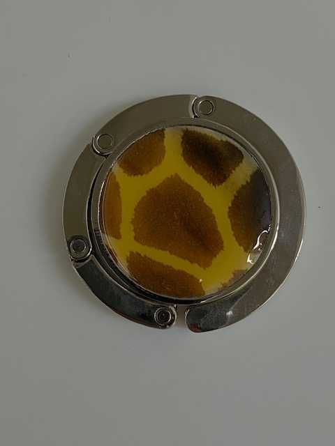 Gancho cabide para pendurar malas em mesa