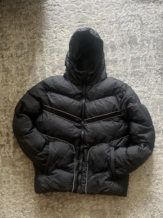 зимній пуховик nike