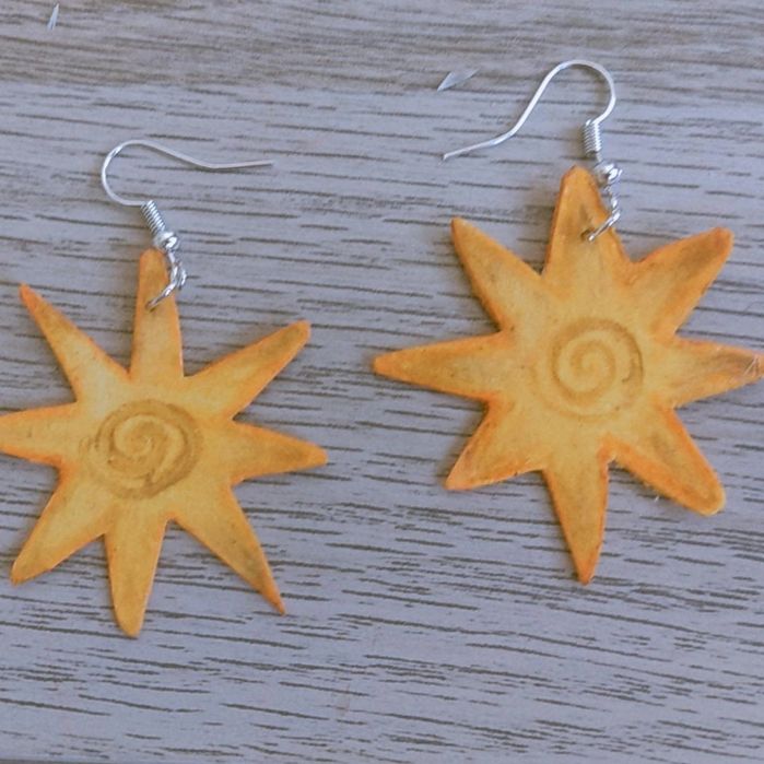 brincos estrela amarelos