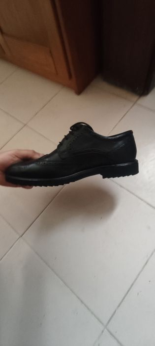 Calçado de homem em pele