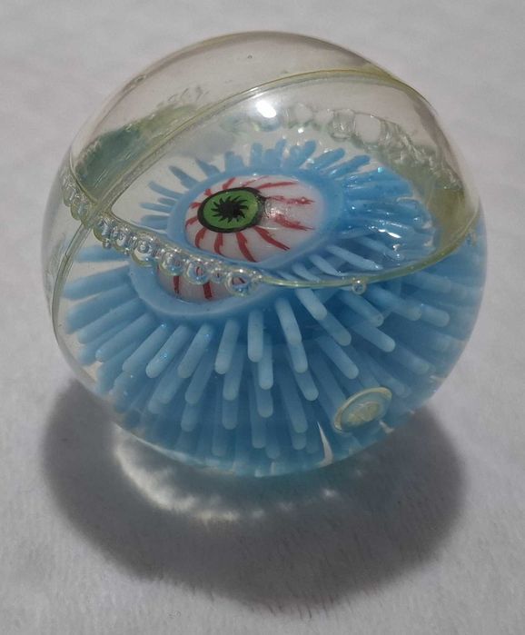 Gumowa kulka z okiem, brokatem, niebieska, 6cm (Zabawka)