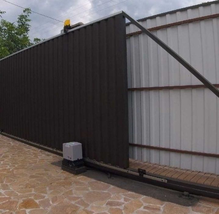 Автоматика для відкатних розпашних секційних воріт / Монтаж по області