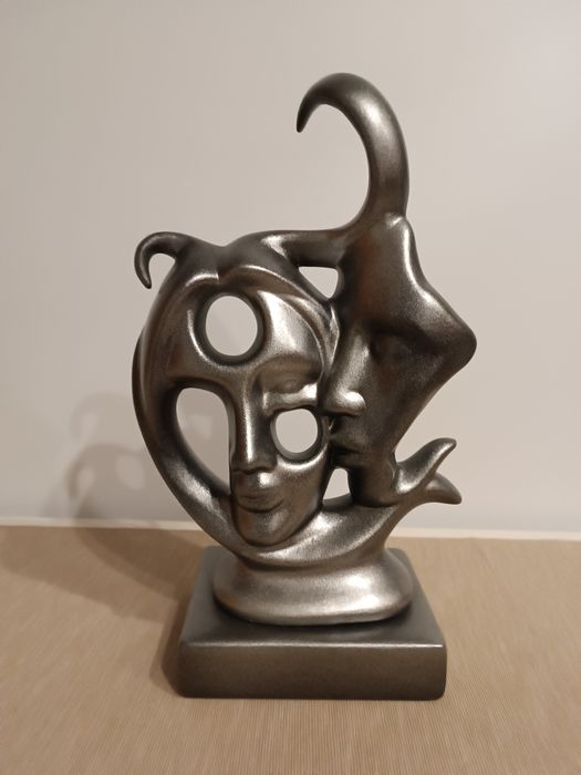 Estatueta dois rostos