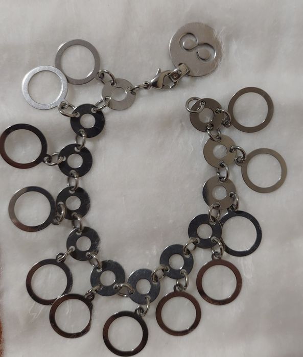 Pulseiras em prata, rodio e aço dourado