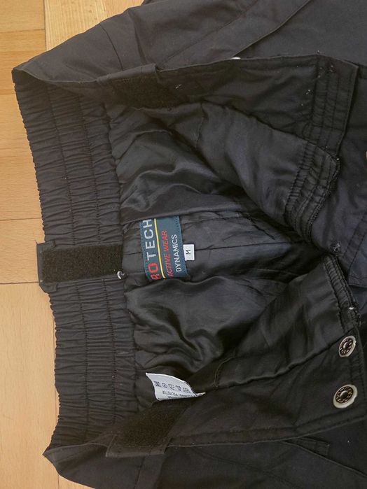 Czarne spodnie sportowe marki Protech Activewear Dynamics.