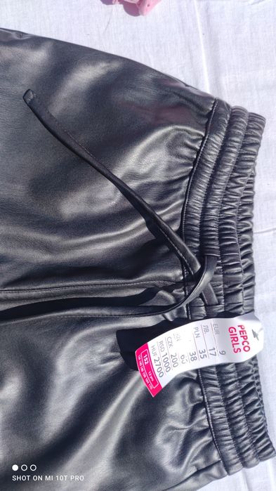 Spodnie sztuczna skóra czarne 152 rozm.