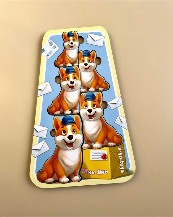 Drewniana układanka większy-mniejszy «Corgi listonosz»