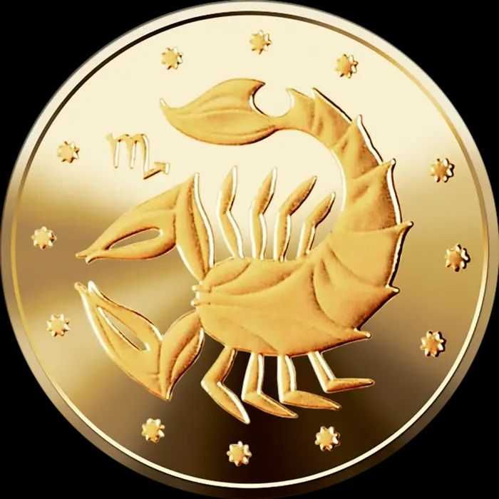 Золотые монеты серии "Найменша золота монета" и "Знаки зодіаку"