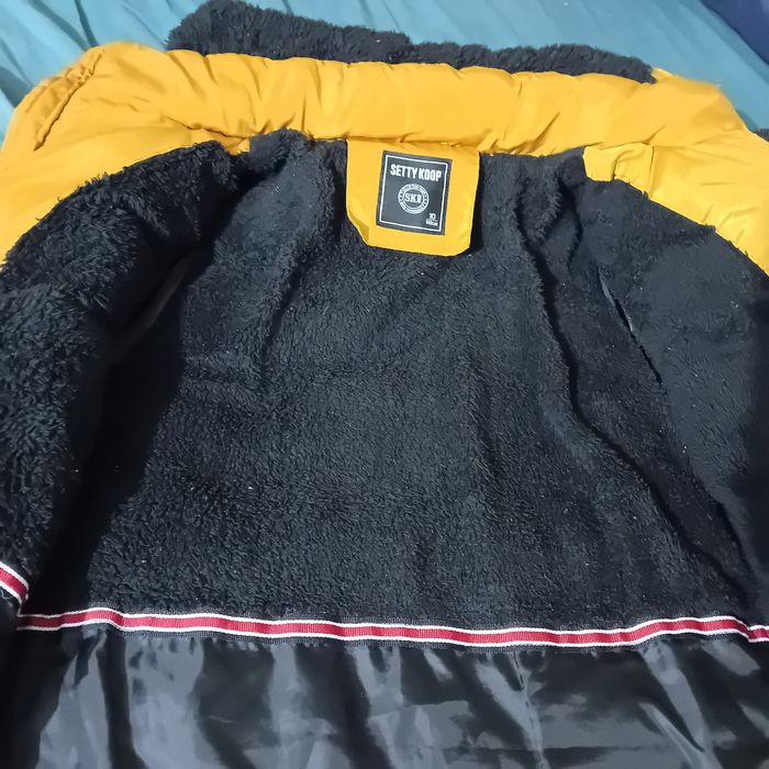 Ruda ciepła kurtka na 140 cm