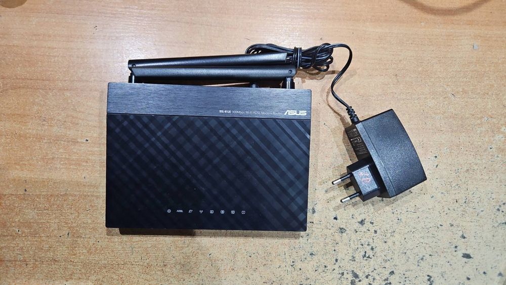 Wi-Fi роутер (маршрутизатор) Asus DSL-N12E_C1,  100mbit/s