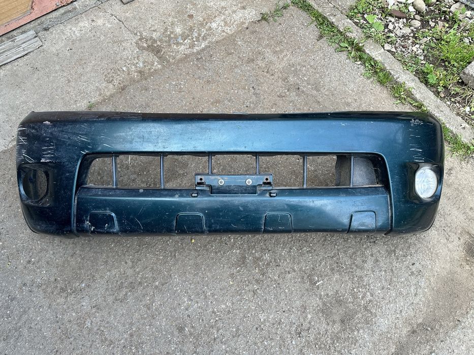 Бампер передній Toyota Hilux 2005-2015 521130K010  + радіаторна решітка