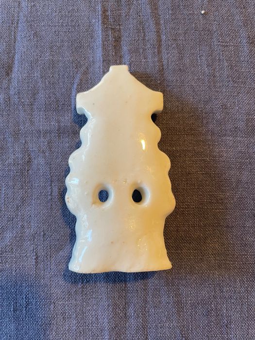 Cruz em porcelana