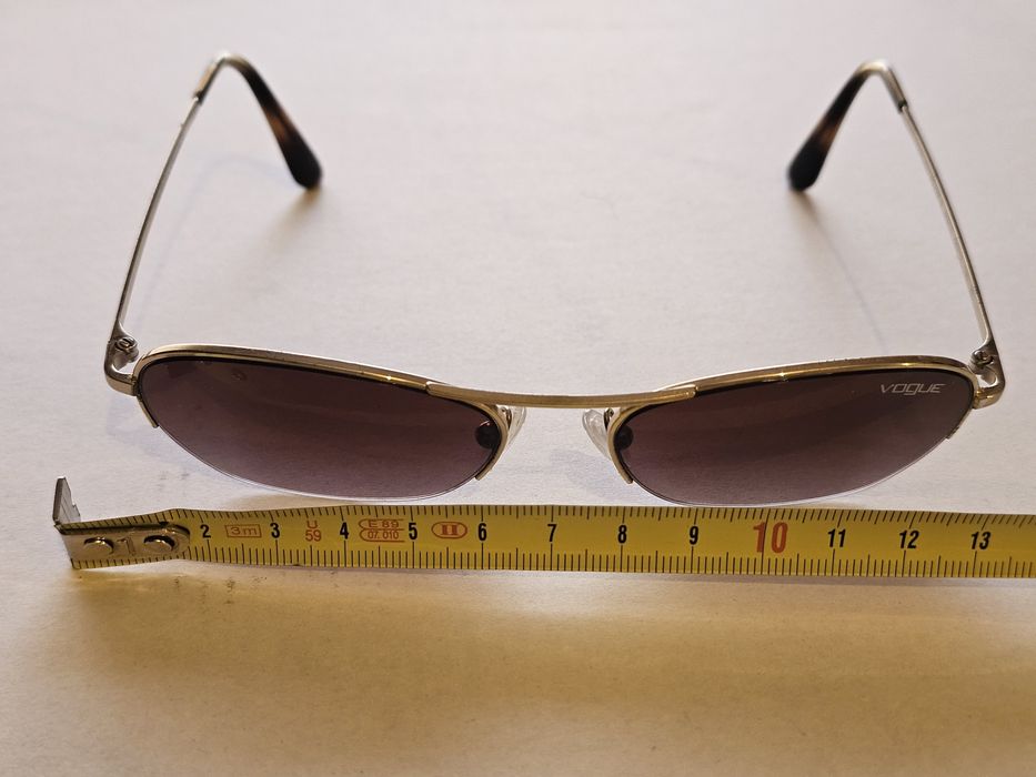 Óculos de Sol com as lentes originais.