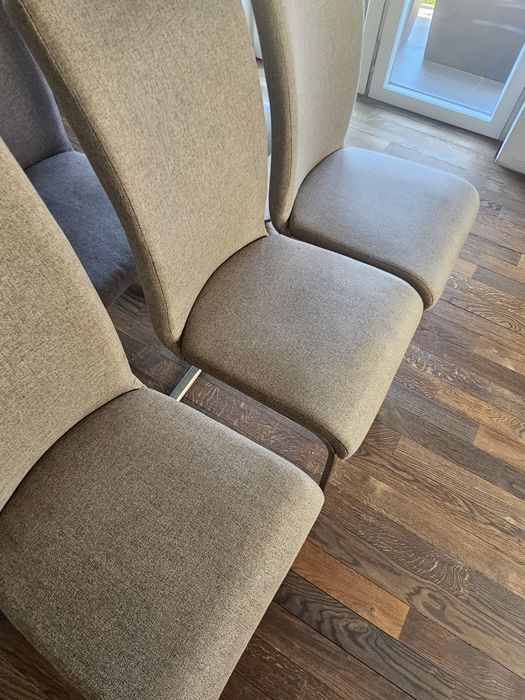 Krzesła bujane tapicerowane na ramie stali nierdzewnej