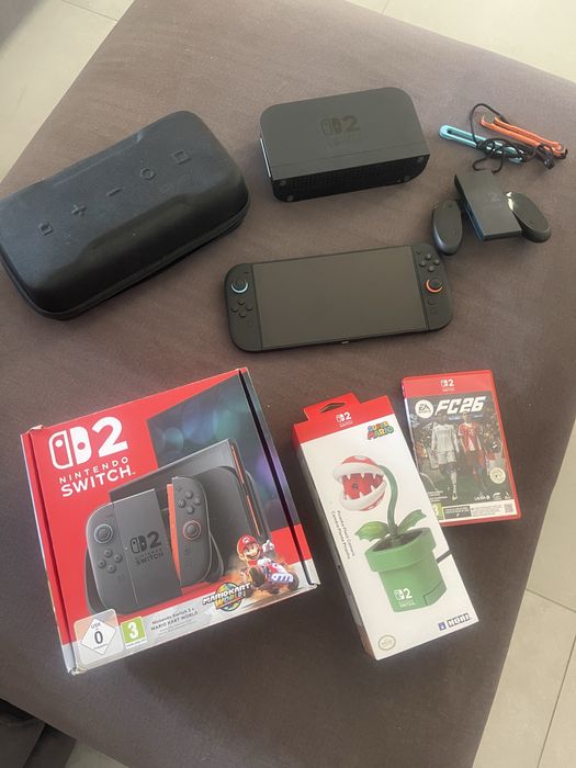 Nintendo Switch 2 + Mario Kart World + FC26 + Caixa de transporte + Câmera planta