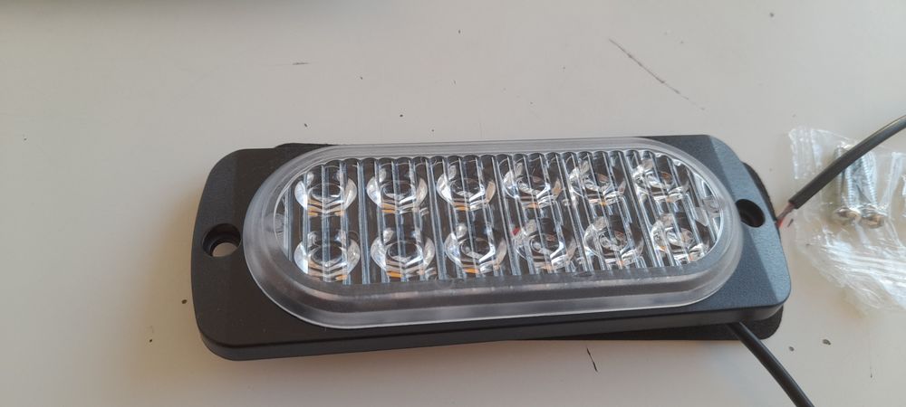 Vendo 2 faróis  luz laranja led fixa