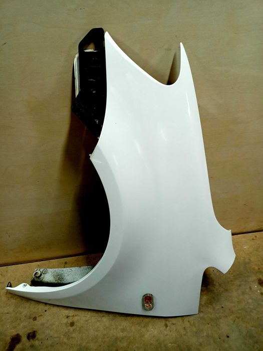 VW Caddy Touran 1 3 lift 2014r. błotnik lewy przód przedni biały