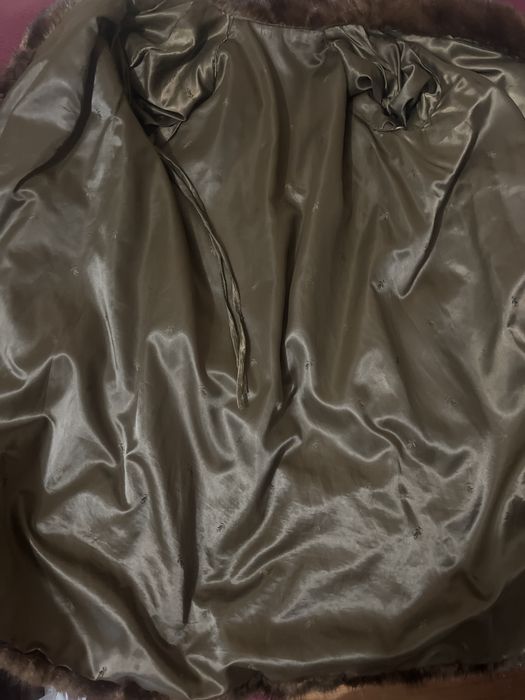 Норкова шуба шита полосами