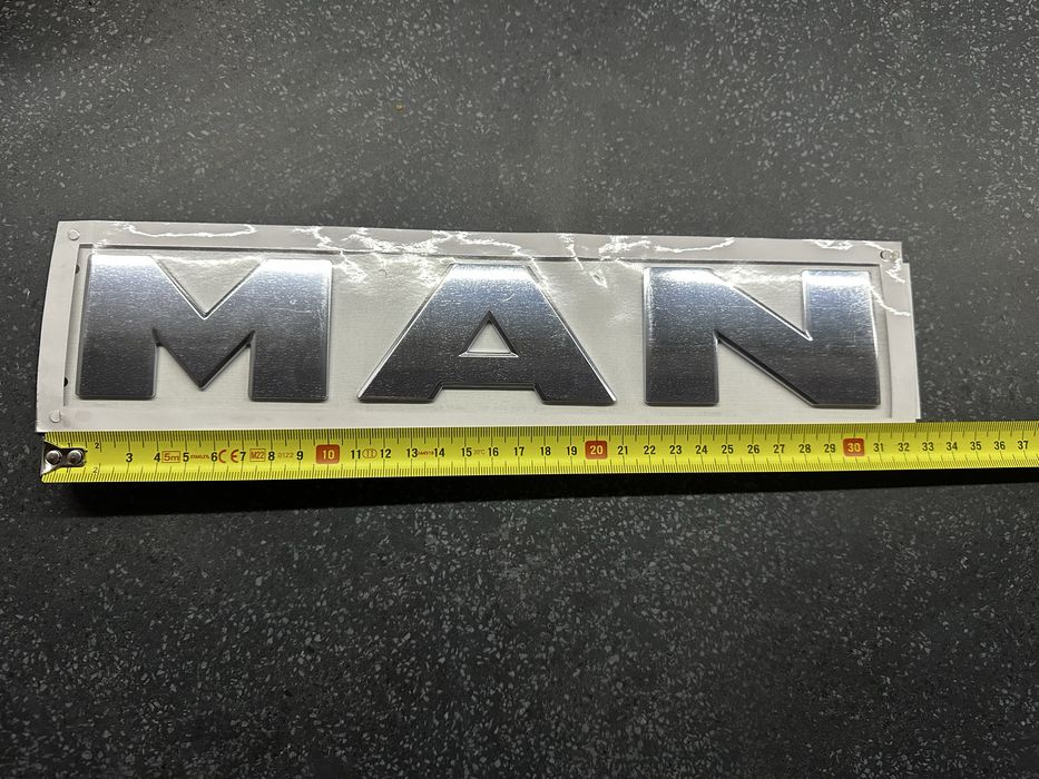 Man Logo znaczek emblemat nowy