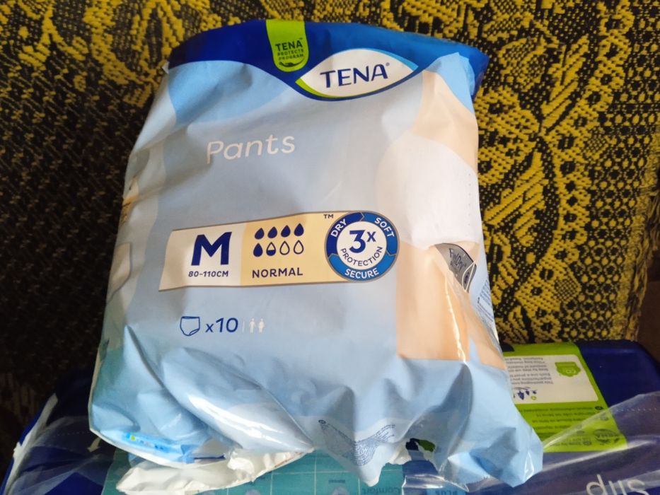 Одноразові пелюшки та підгузки  Tena