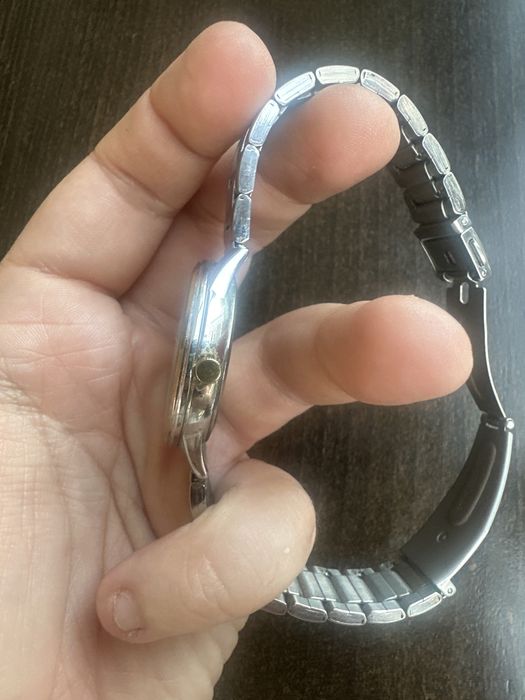 Relogio Radiant dourado e cinza