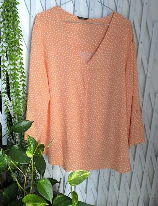 Blusa com modelagem fluída e jovial que dentro da sua simplicidade transita para um look casual - Tam - XXL    Modalfa