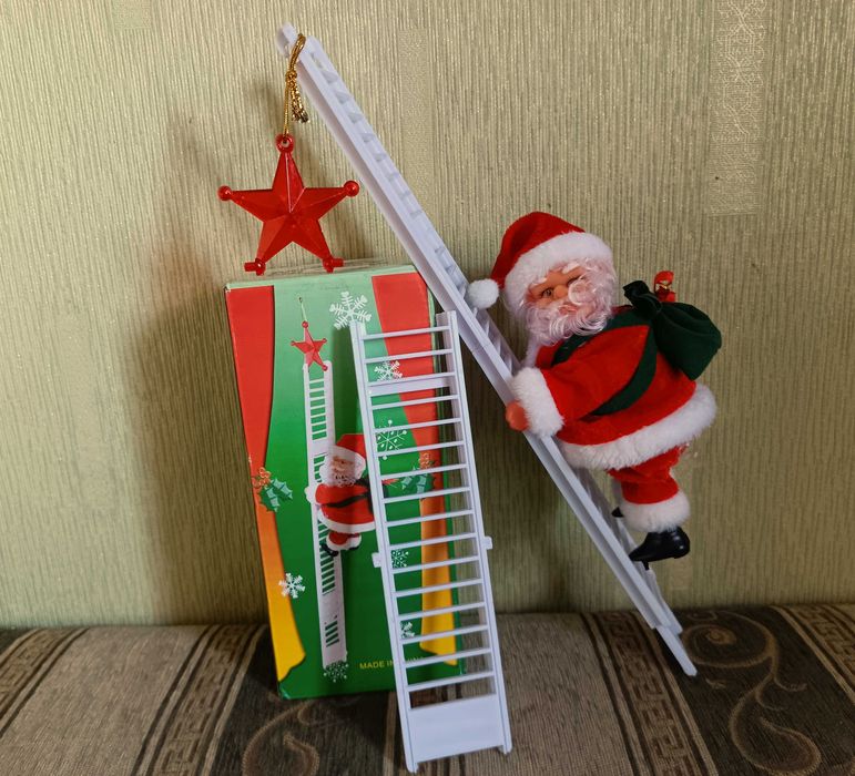 Новорічна музична іграшка Санта Клаус на драбині