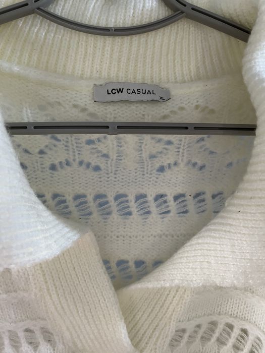 Вʼязані кофти молочного кольору