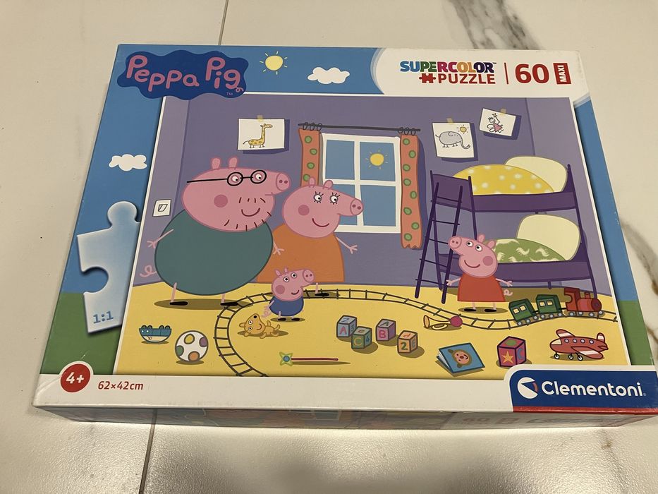 Dwa pudelka puzzli swinka pepa