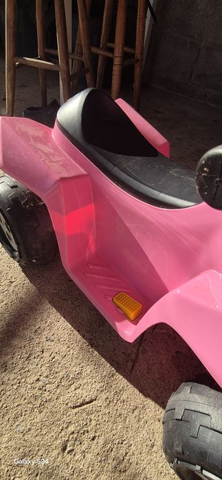 Moto rosa criança