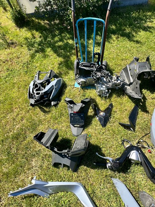 Części do  nowego Sym Cruisym 125 silnik lagi licznik koła owiewki