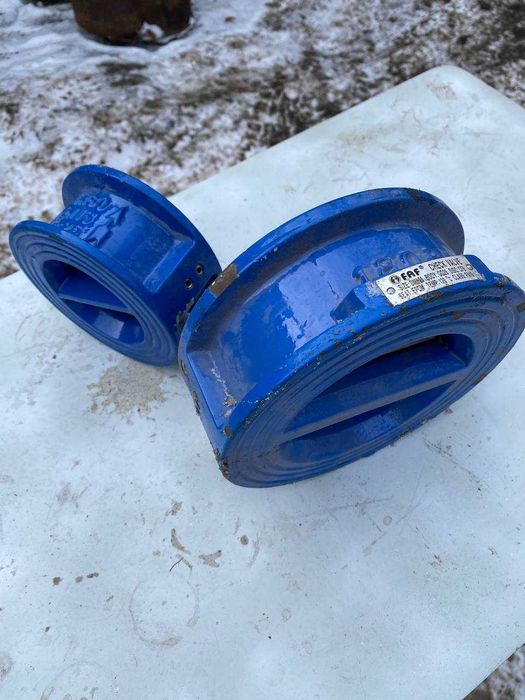 двухстворчатый меж фланцевый обратный клапан.