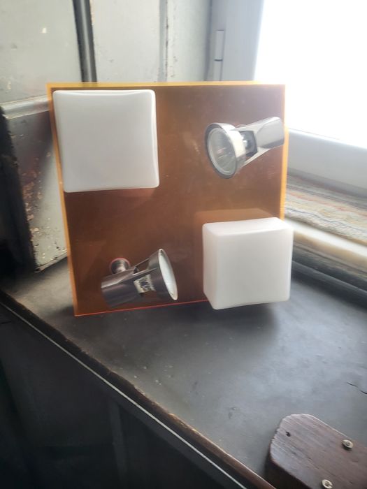 Ceiling light fixture made of glass, metal, and acrylic