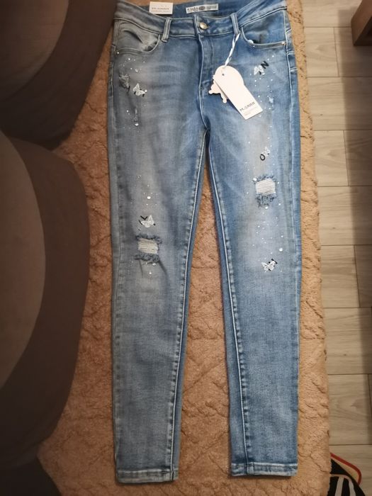 Nowe spodnie niebieskie M Sara 31 push up cekiny motyle