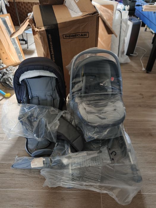 Duo bebecar ip op evolution com sombrinha e tapa sol