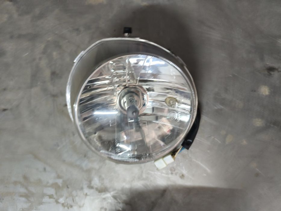 Sym fiddle farol frente original