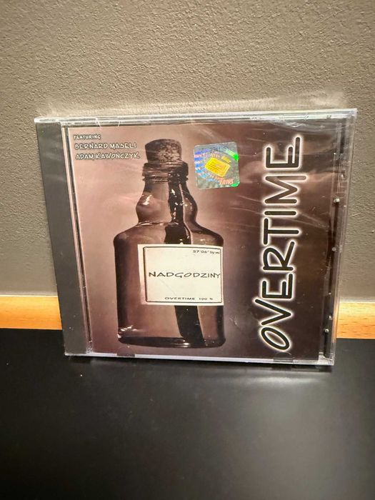 Overtime, Nadgodziny, Bernard Maseli, Adam Kawończyk, nowa