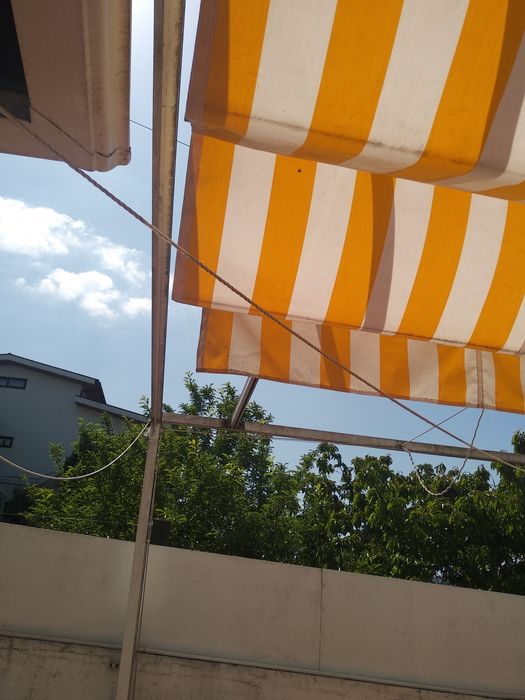 Pérgola de encostar com tecido