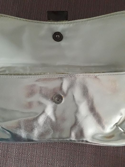 Новая косметичка/сумочка- клатч Ungaro ( Avon)