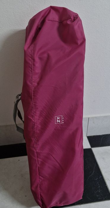 Cama de viagem em rosa