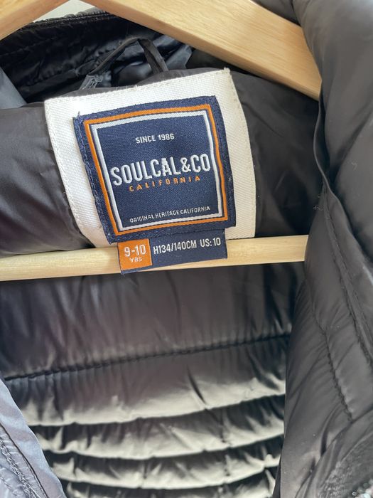 Casaco preto de penas praticamente novo