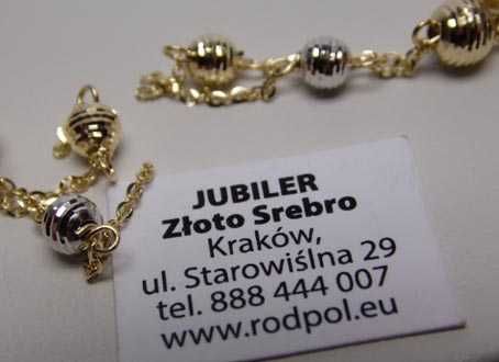 Złote wiszące kolczyki łańcuszki diamentowane dwukolorowe kulki.